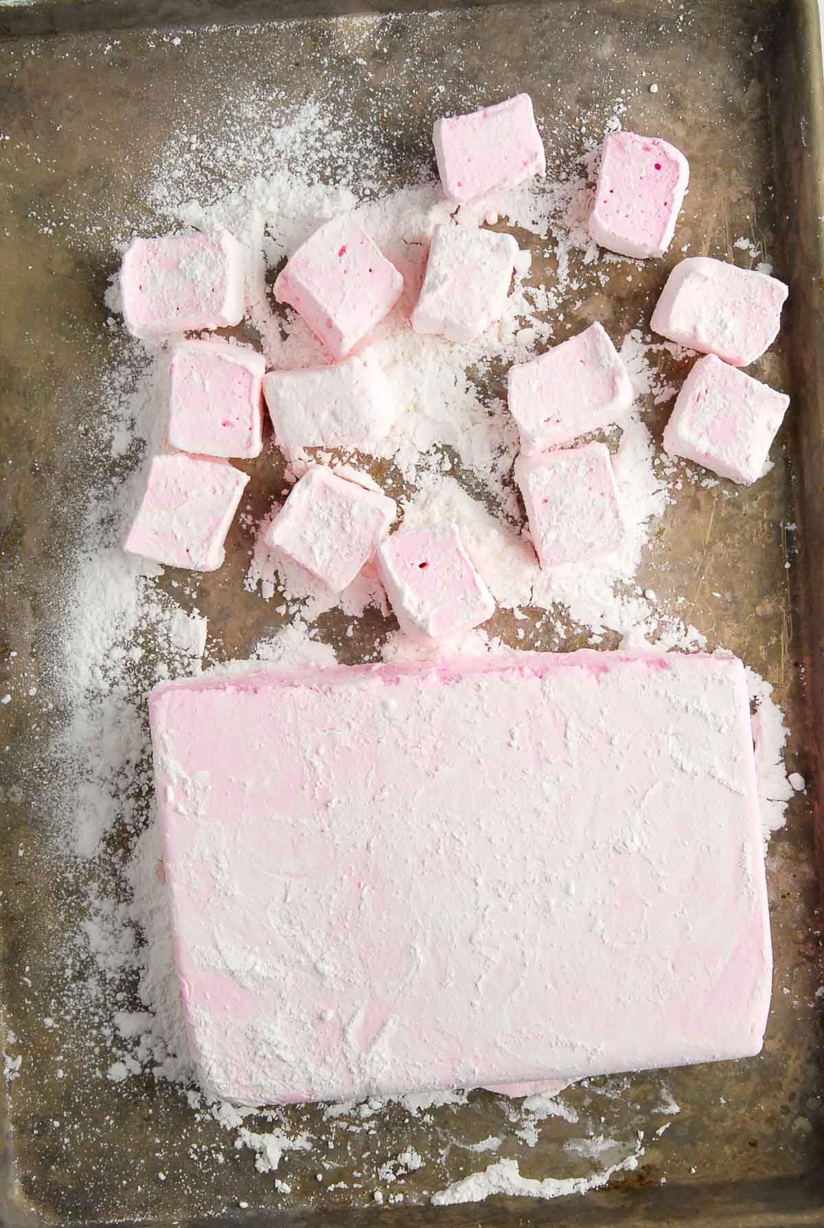 rose flavored homemade marshmallows on baking sheet.