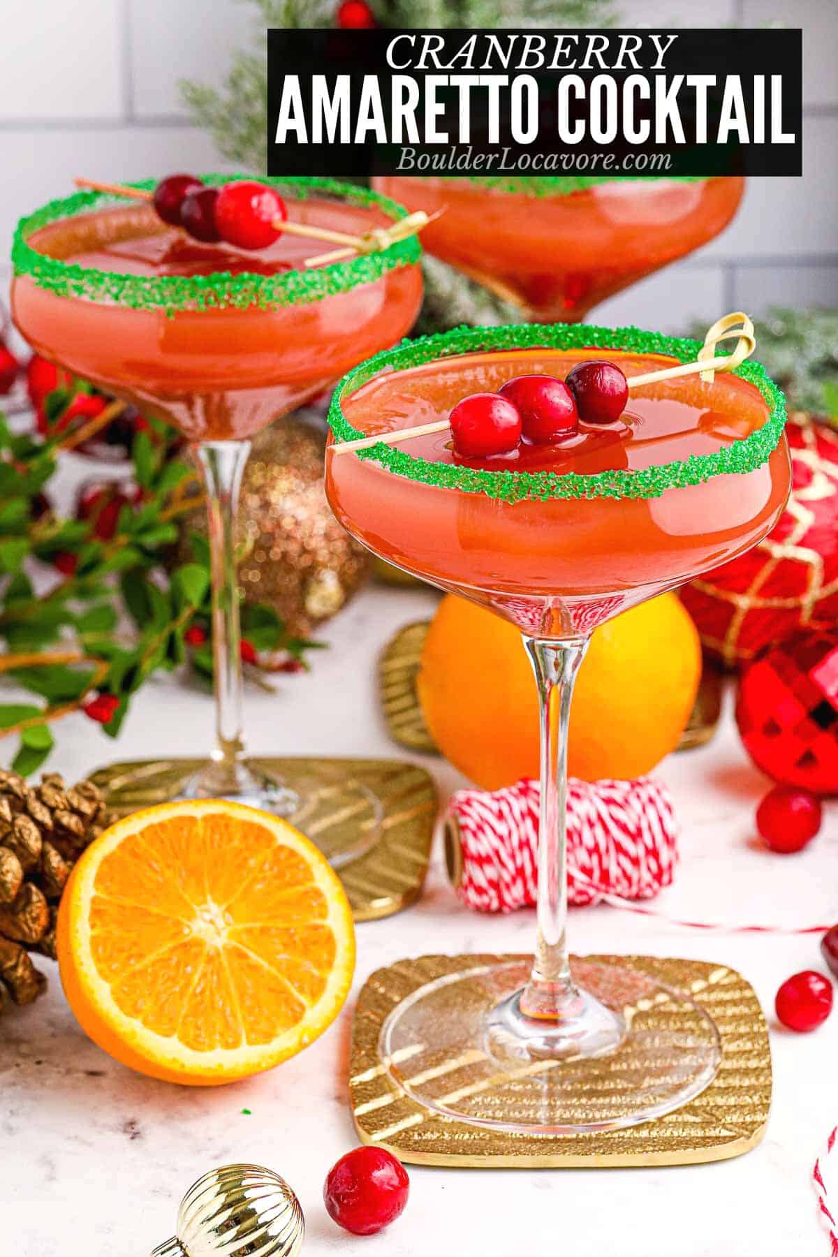 cranberry amaretto cocktail with holiday decor.