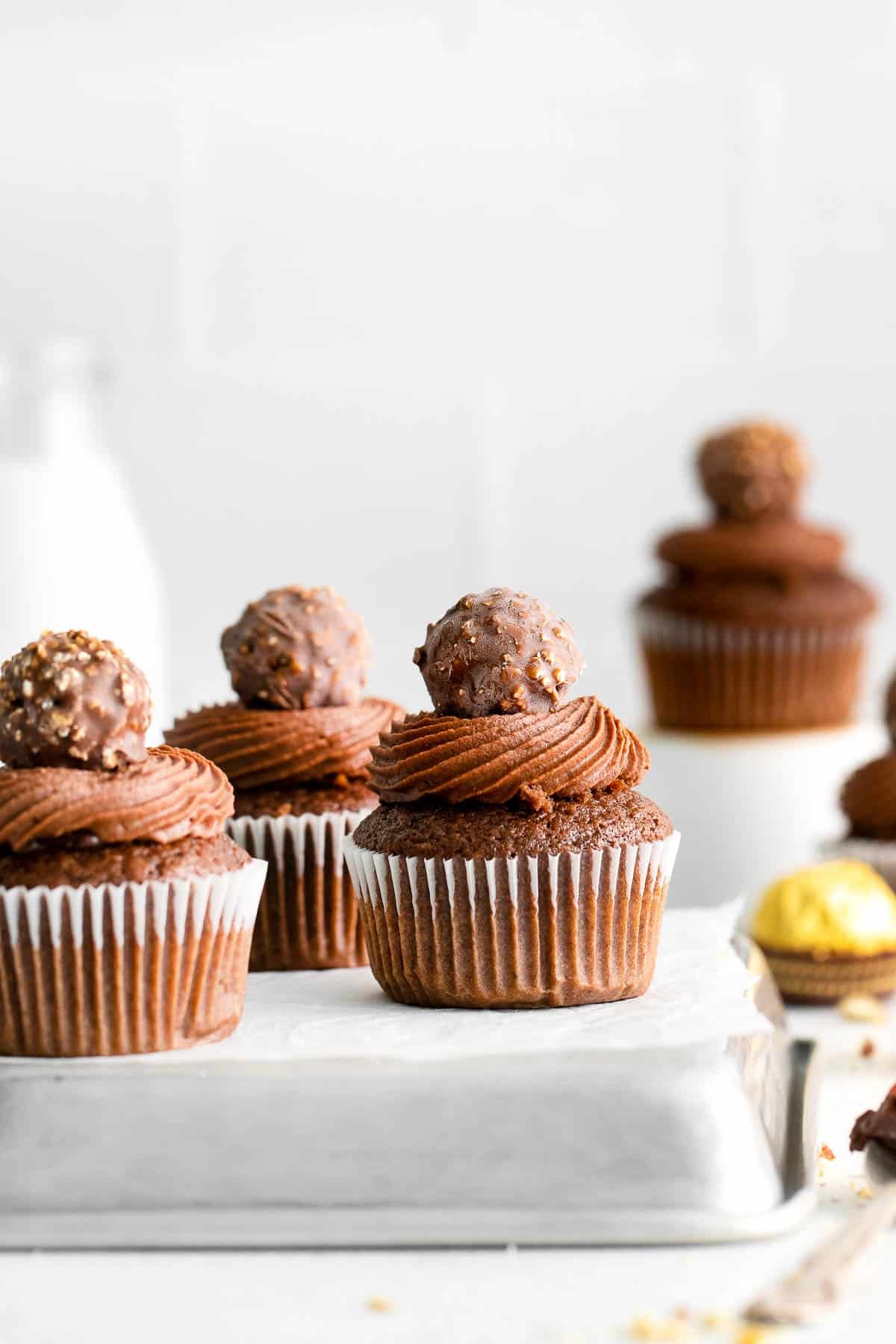 ferrero rocher cupcakes on a metal baking sheet