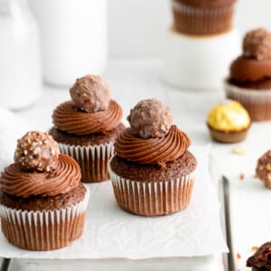 ferrero rocher cupcakes on a metal cooling rack crop.