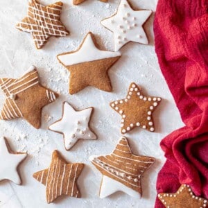 gingerbread star cookies on plate with milk.