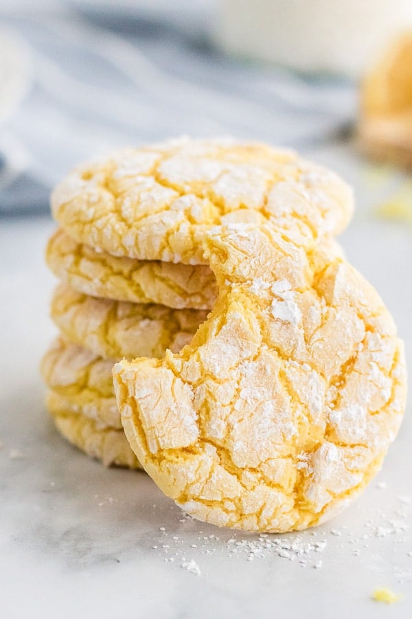 stack of lemon cookies with bite out of one