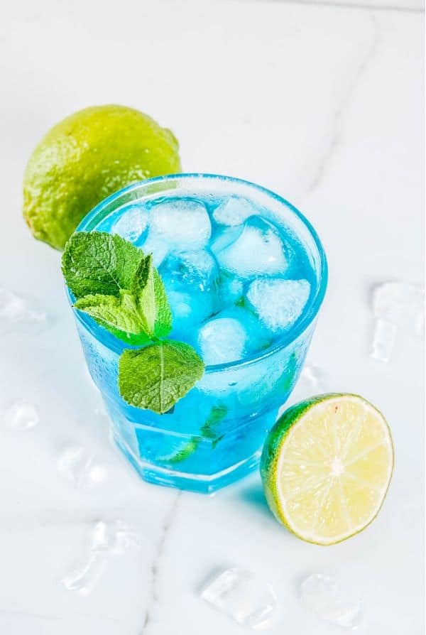 Blue Margarita with lots of ice and lime wedges