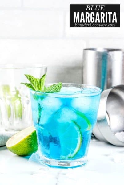 Blue Margarita in glass with ice with title