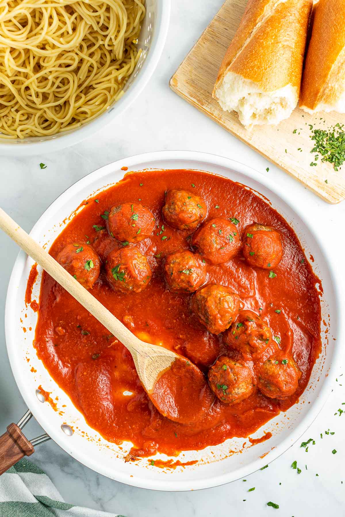 baked Italian Meatballs in skillet with spoon