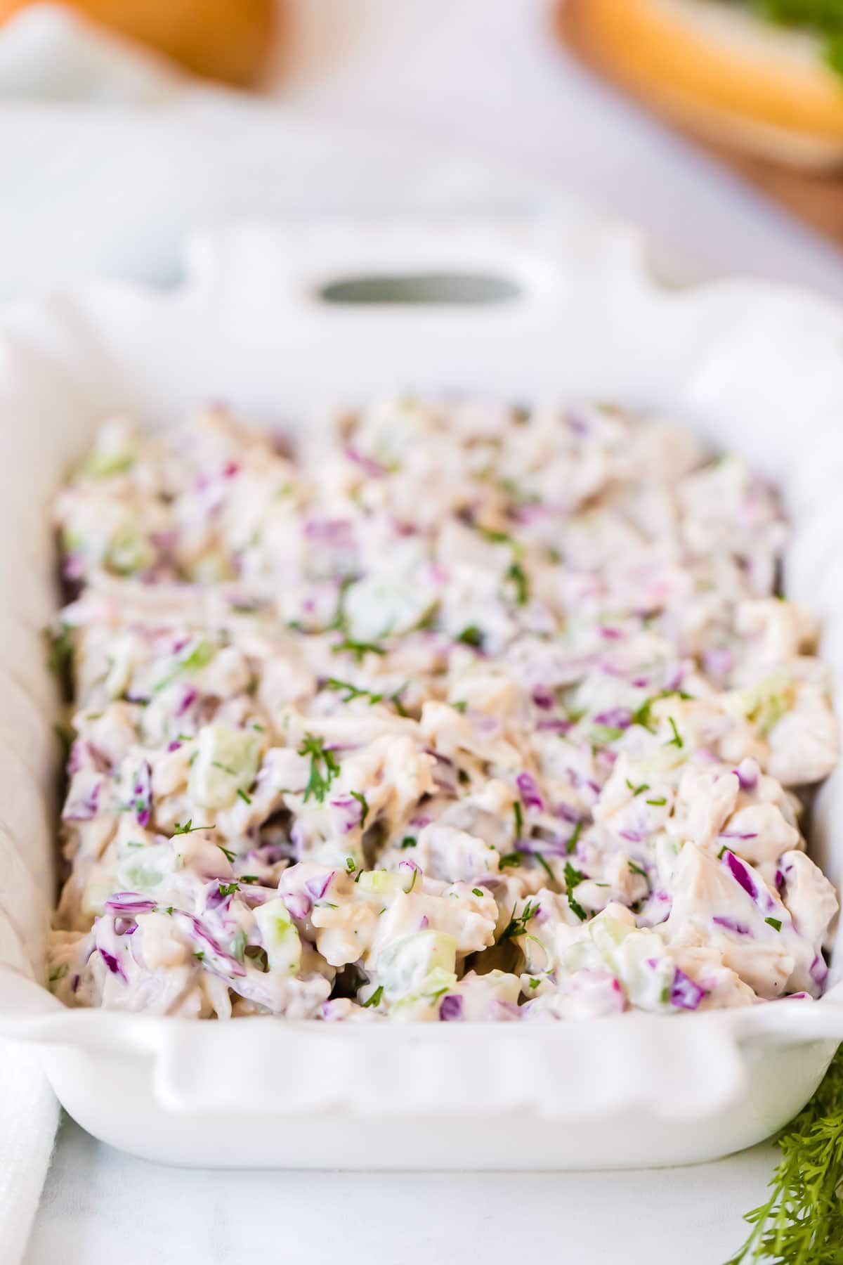 batch of homemade chicken salad in a white square serving dish