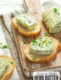slices of bread with herb butter on cutting board